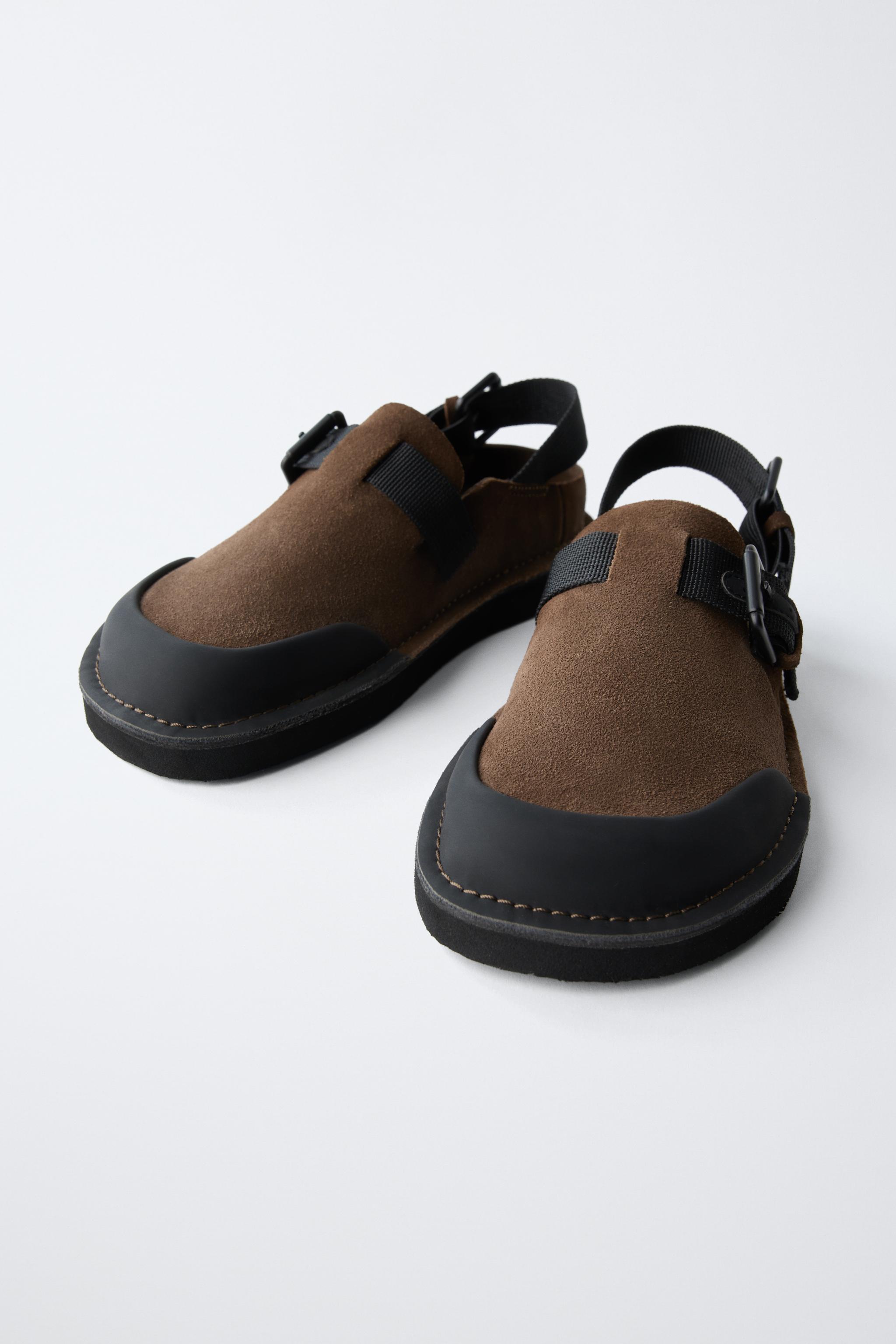BUCKLED CLOGS